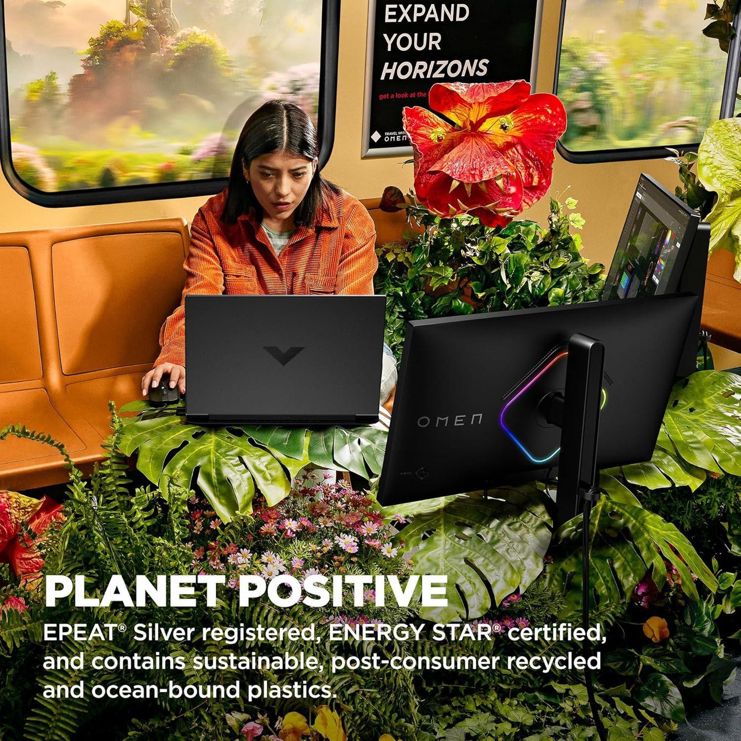 Person using a Victus 15.6 inch gaming laptop from TechNest in a vibrant, nature-themed workspace