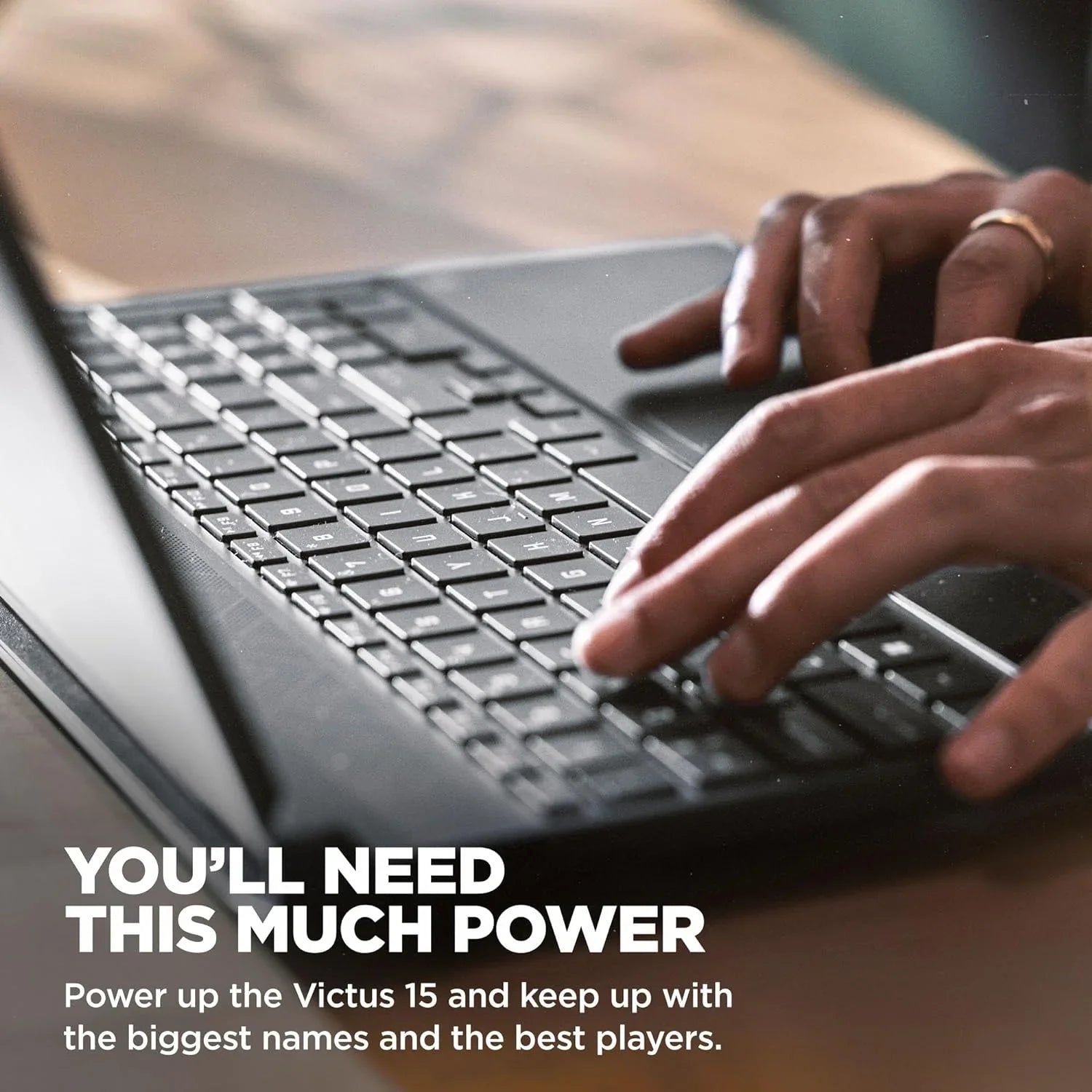 Hands typing on the keyboard of a Victus 15.6 inch gaming laptop by TechNest in use